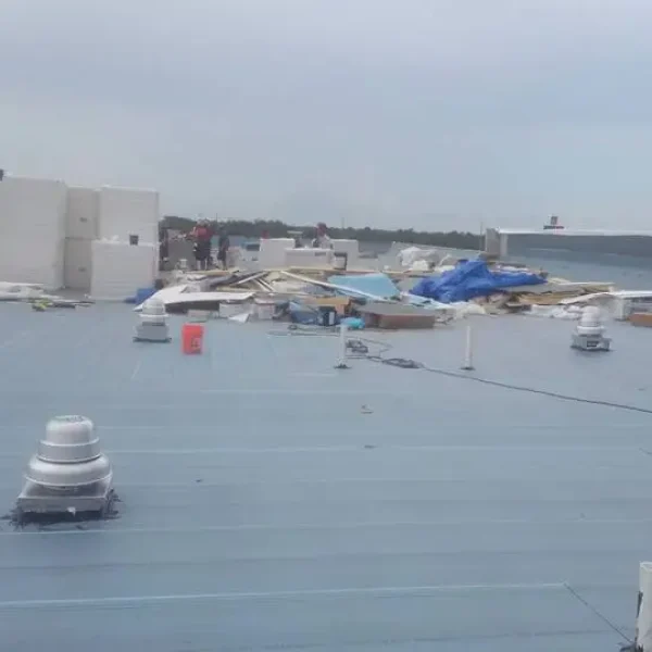 Flat commercial rooftop with vents, ducts, and HVAC units, illustrating Kuykendall Roofing’s work with TPO and low-slope roof systems