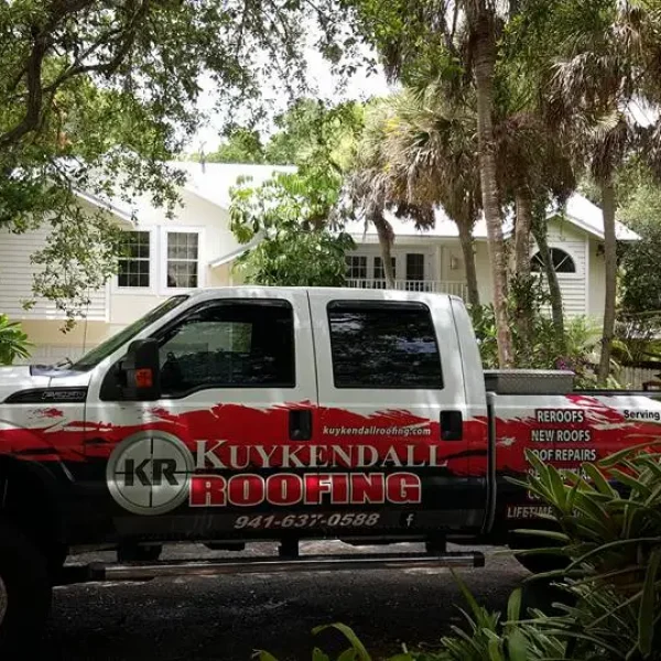 Kuykendall Truck Kuykendall Roofing branded work truck parked in front of a residential home in Florida, representing the company’s commitment to local service and professional roofing careers